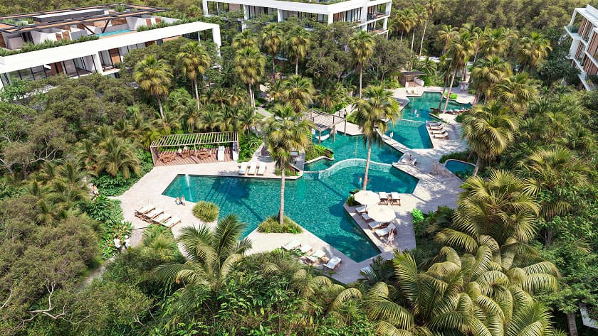 Render aéreo de las albercas de Bakabá rodeadas de vegetación tropical